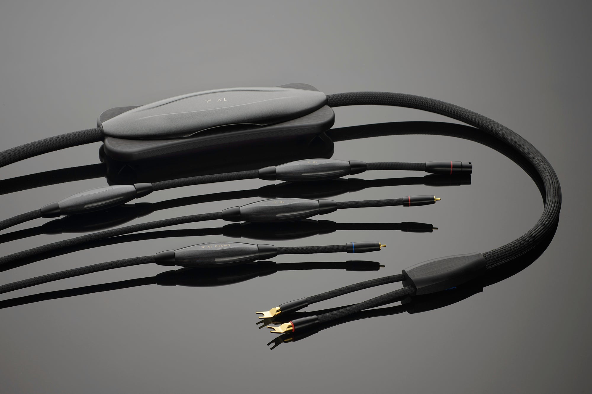 A black cable with four wires on it.