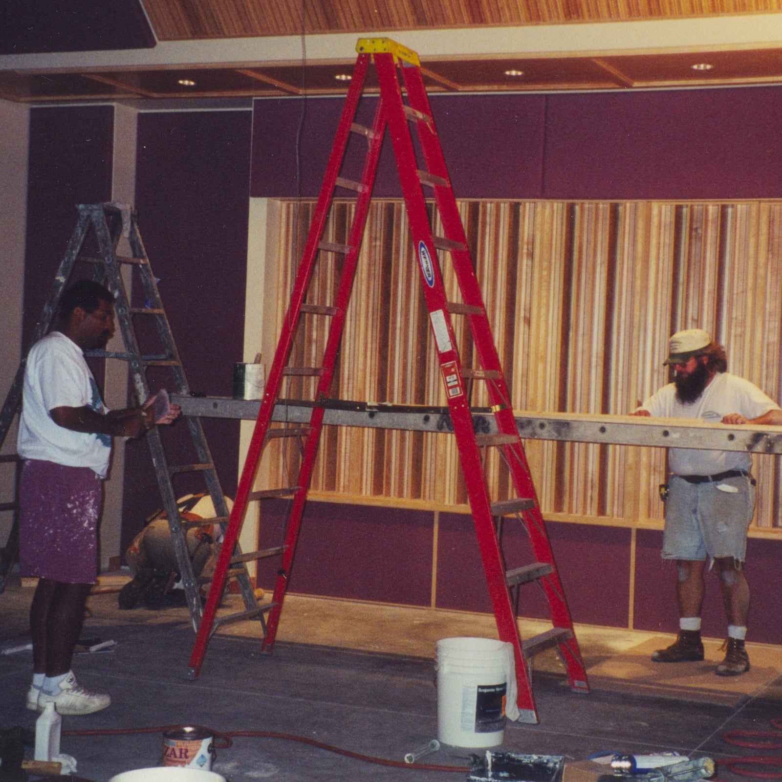 A red ladder in a room.