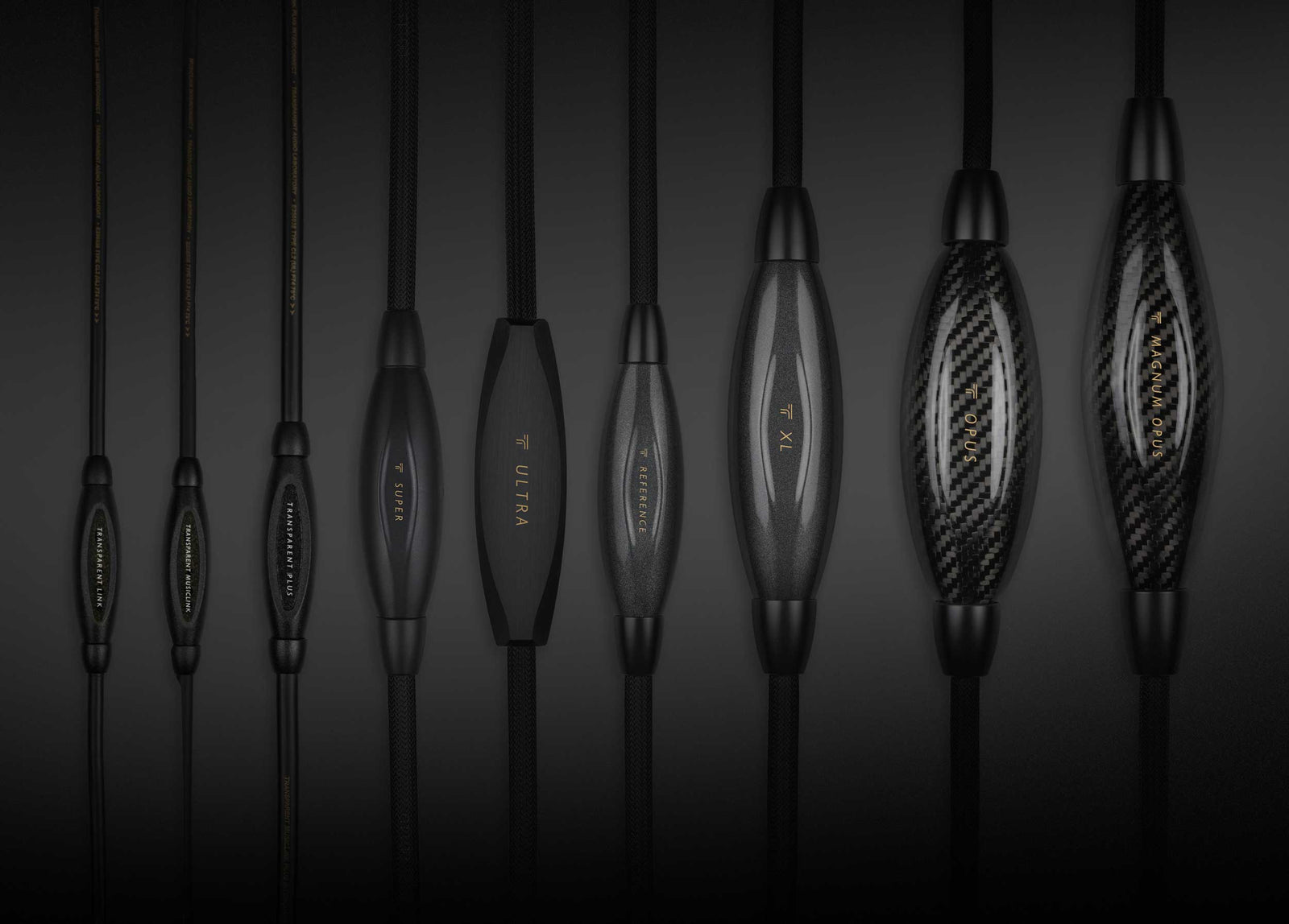 A group of black headphones on a black background.