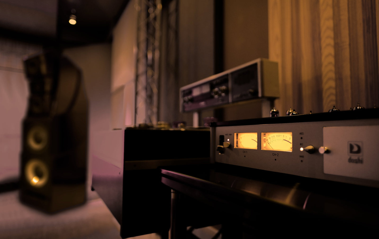 A stereo system in a room with a speaker.
