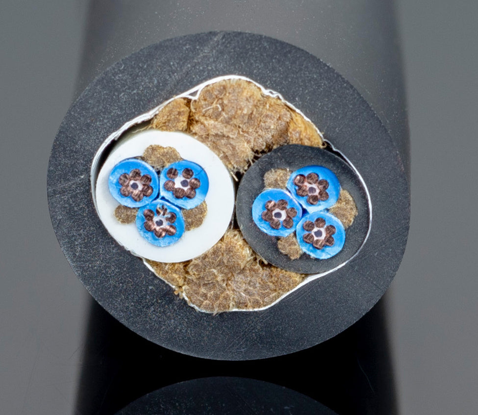 A black cable with blue flowers on it.