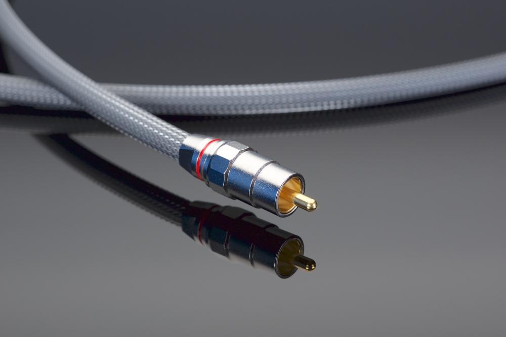 A close up of a silver audio cable.