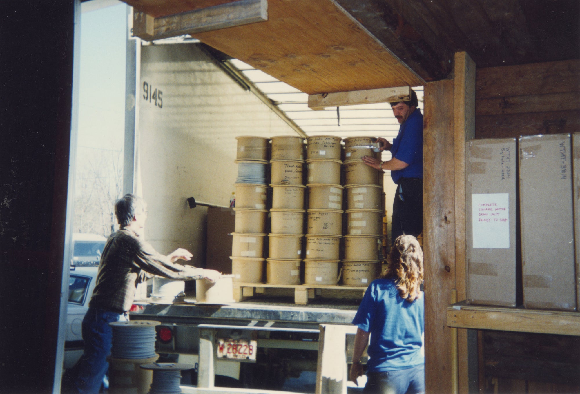 A man loading boxes into a truck.