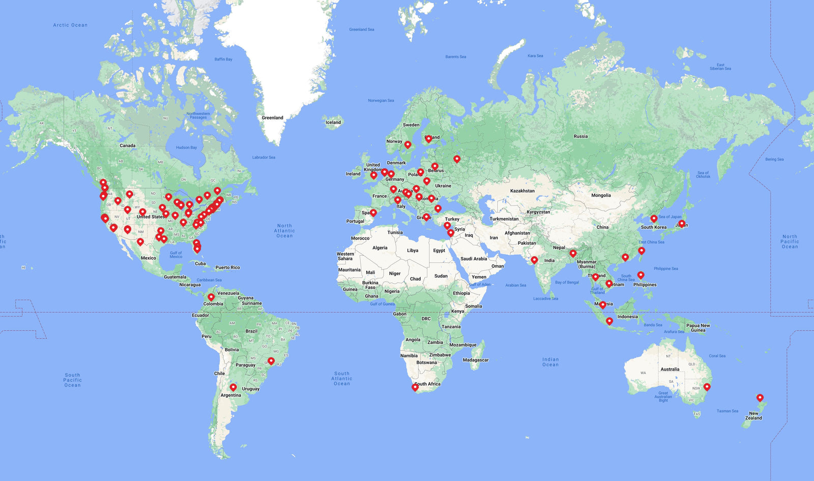 A map of the world with red dots on it.